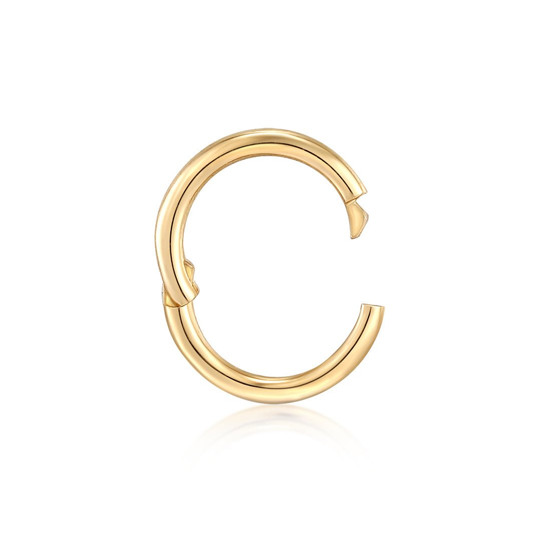 Crafted in 14k solid gold this hinged charm connector can multi-task like a pro.  Pair it with your favorite charms and add it to a necklace or bracelet, or wear it in your ear stack. 