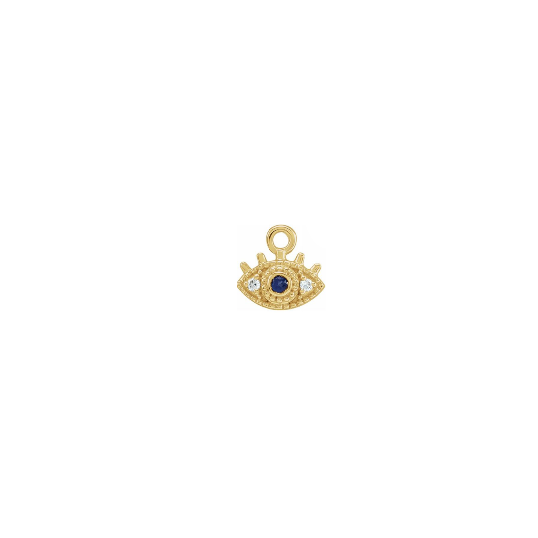 14k yellow gold petite evil eye charm with a blue sapphire and white diamonds on a white background