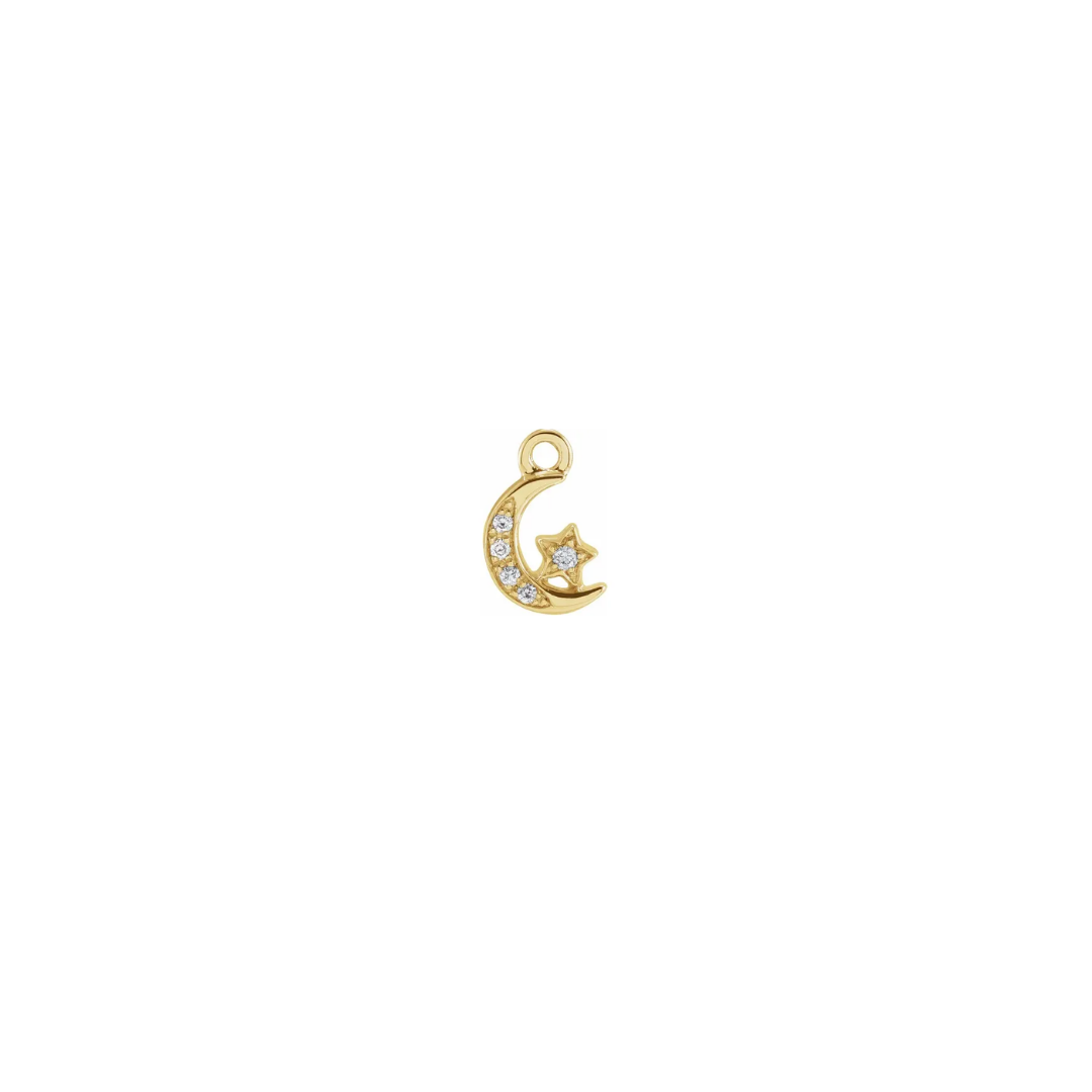 Petite 14k yellow gold diamond celestial charm with a moon and star on a white background