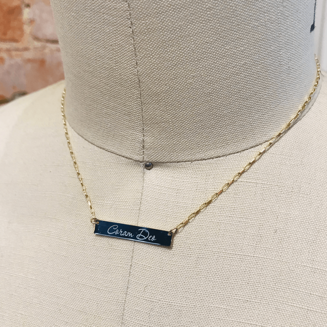 The Modern Bar Necklace  shown in a horizontal placement, along with a personalized engraving in script. 